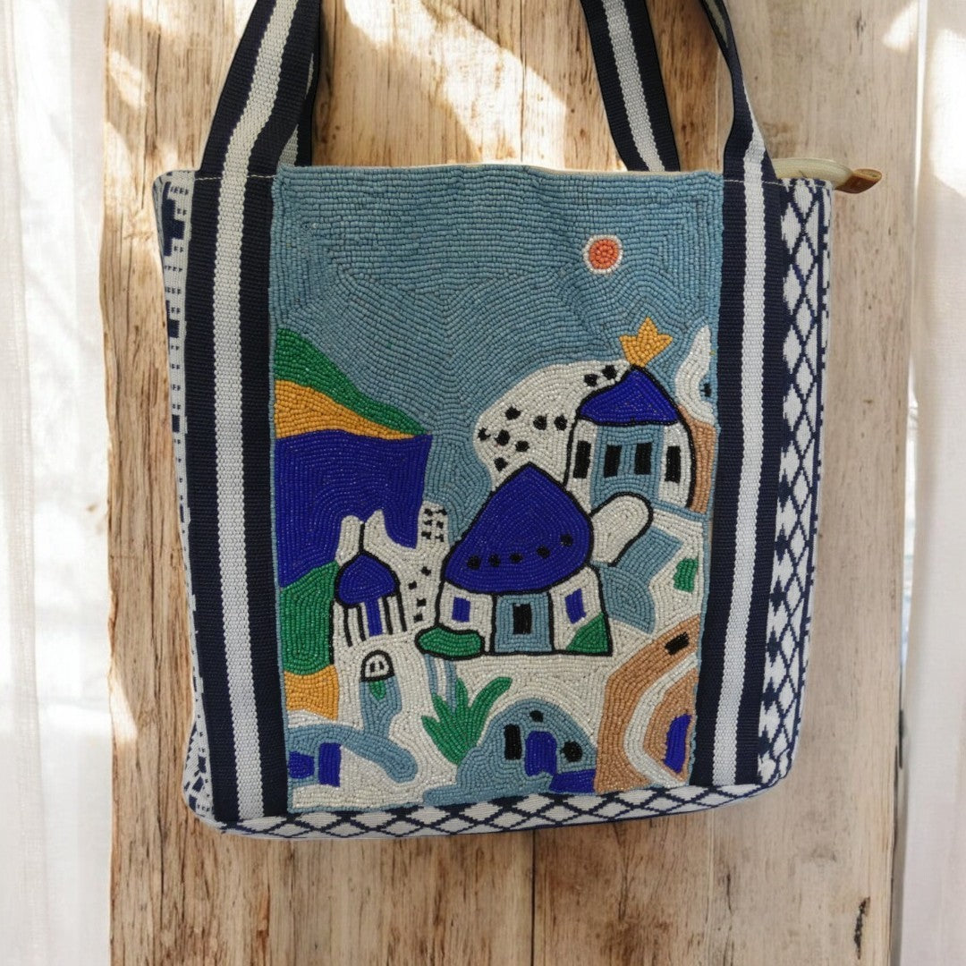 Santorini Style Beaded Bag In Blue, White, Yellow And Green With Striped Detail on the straps and a tribal pattern around the outside in blue and white