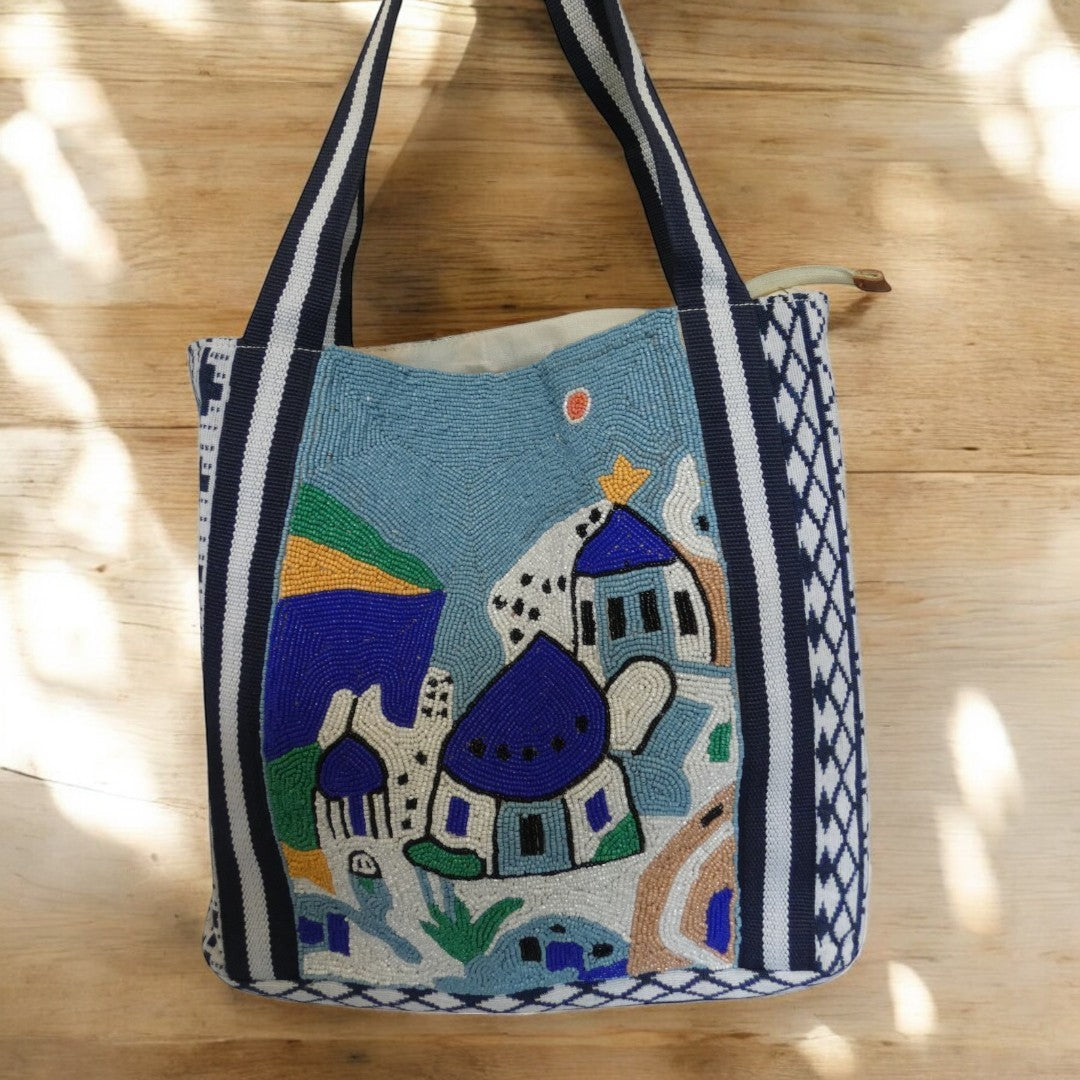 Santorini Style Beaded Bag In Blue, White, Yellow And Green With Striped Detail on the straps and a tribal pattern around the outside in blue and white
