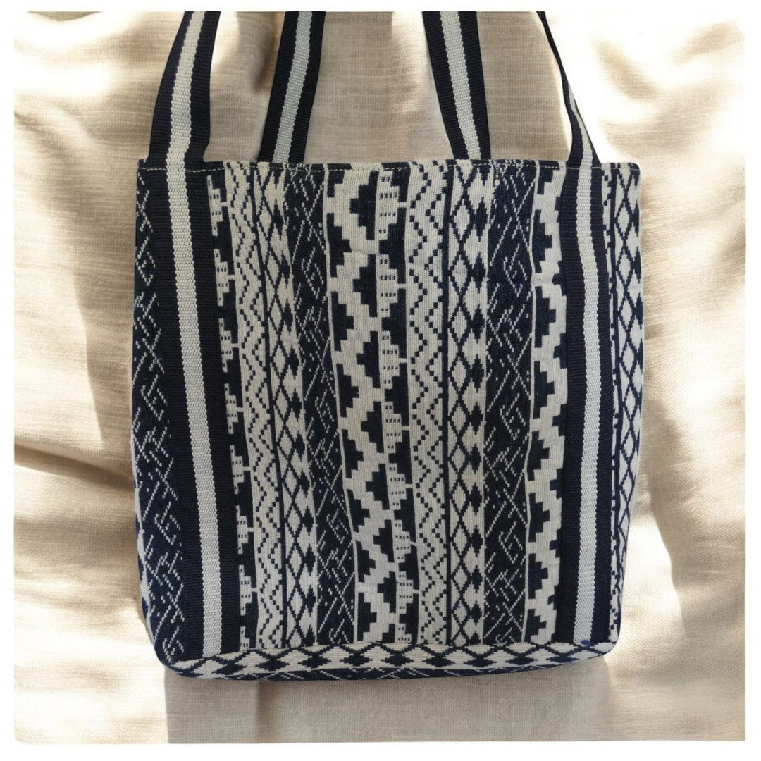 Santorini Style Beaded Bag In Blue, White, Yellow And Green With Striped Detail on the straps and a tribal pattern around the outside in blue and white