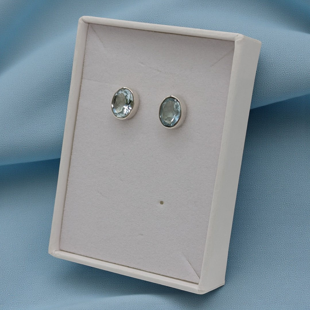 Sterling Silver Blue Topaz Oval Stud Earrings 0.4"