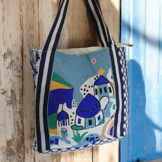 Santorini Style Beaded Bag In Blue, White, Yellow And Green With Striped Detail on the straps and a tribal pattern around the outside in blue and white