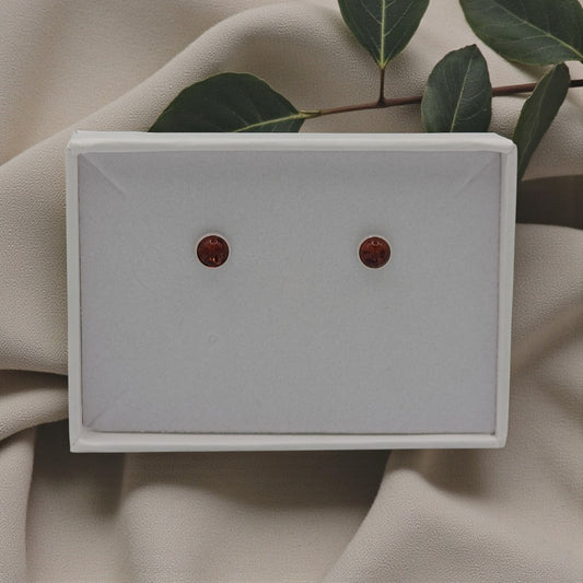 A pair of amber stud earrings in sterling silver