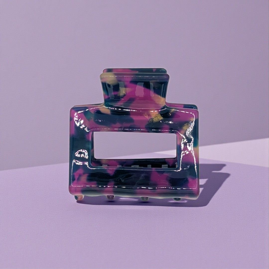 A small hair claw clip in purple