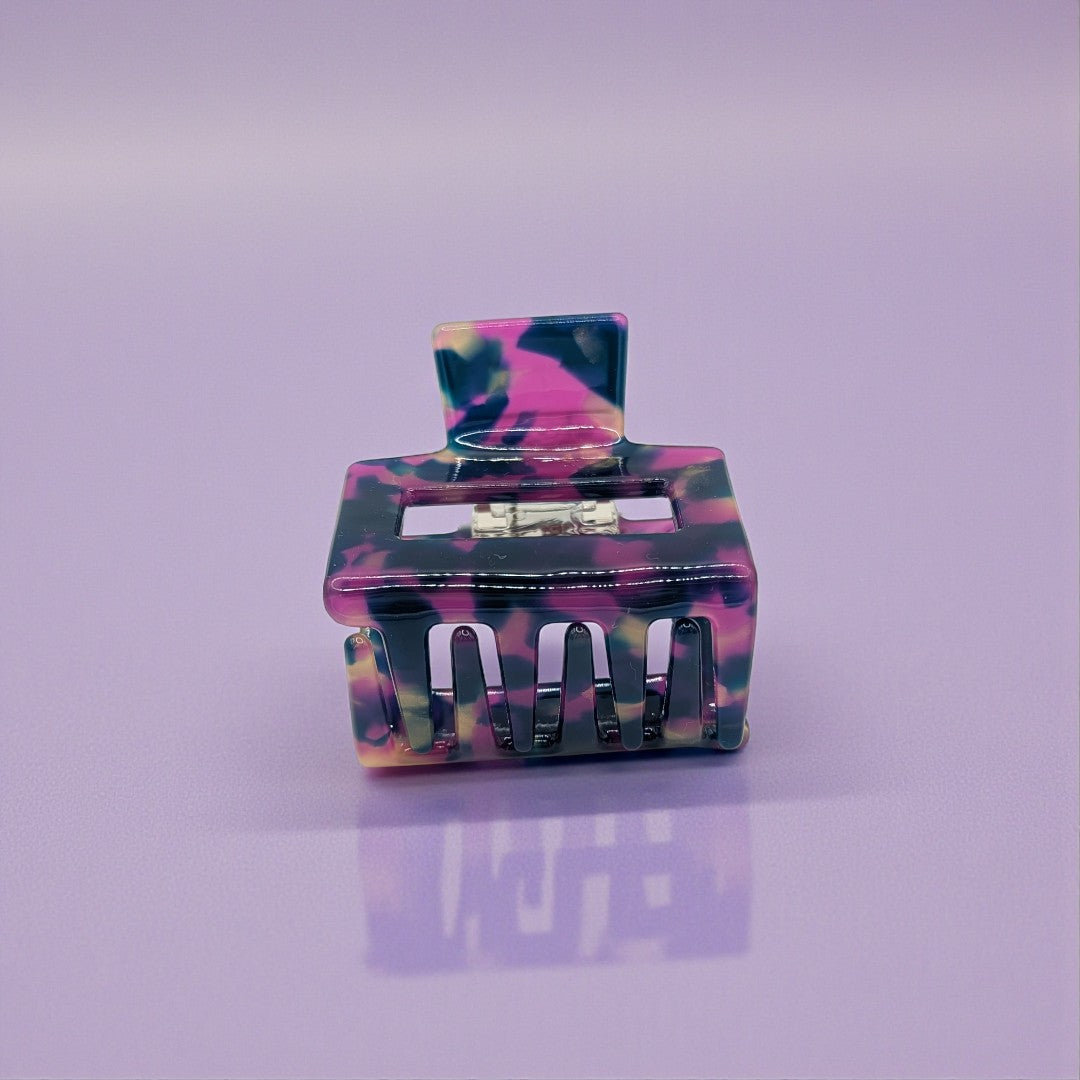 A small hair claw clip in purple